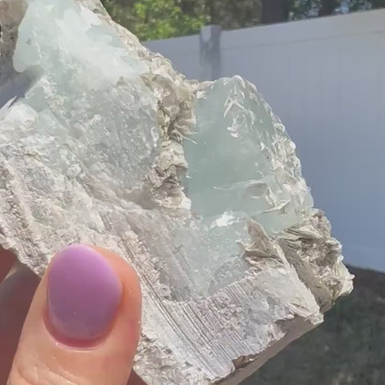 Aquamarine on muscovite 414grams cluster