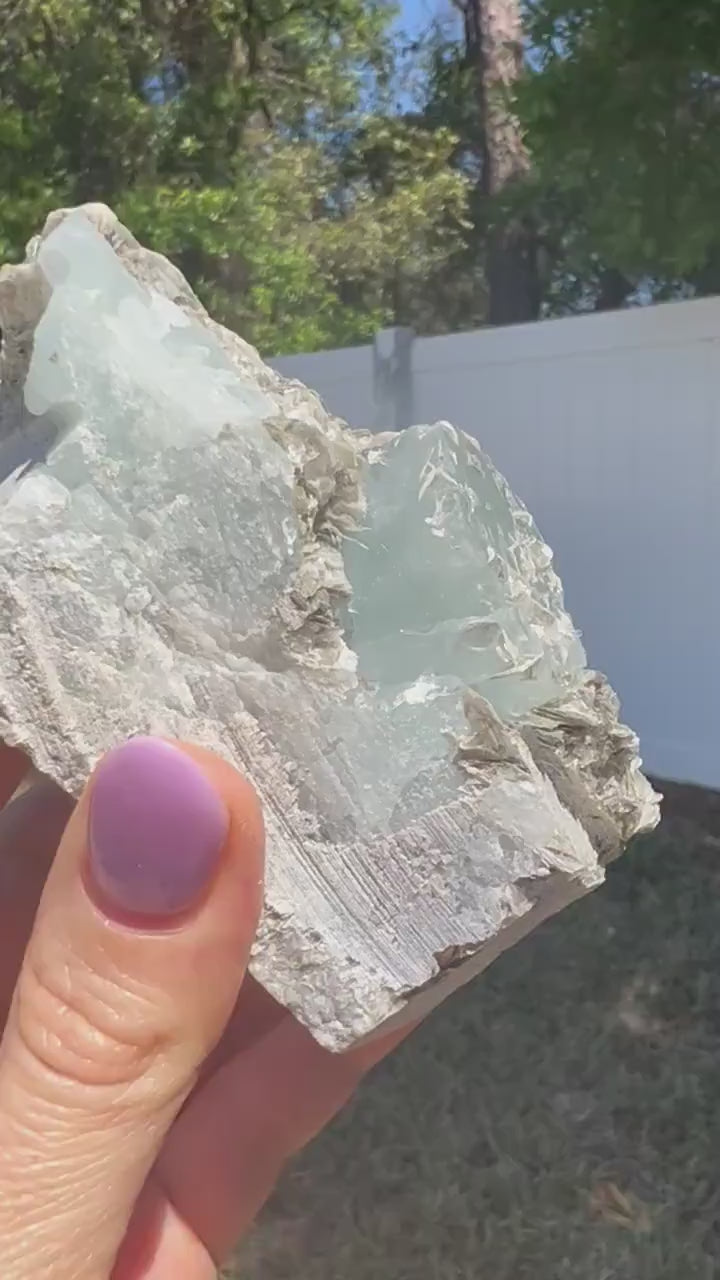 Aquamarine on muscovite 414grams cluster