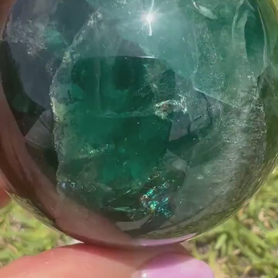 2 sphere set total weight 1pound 8oz. 1 moss agate and 1 dark green fluorite.