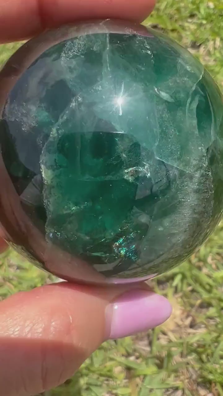 2 sphere set total weight 1pound 8oz. 1 moss agate and 1 dark green fluorite.