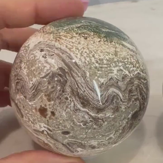2 Petrified wood spheres from Madagascar. You will get the 2 in the picture total weight 1 pound 13oz .