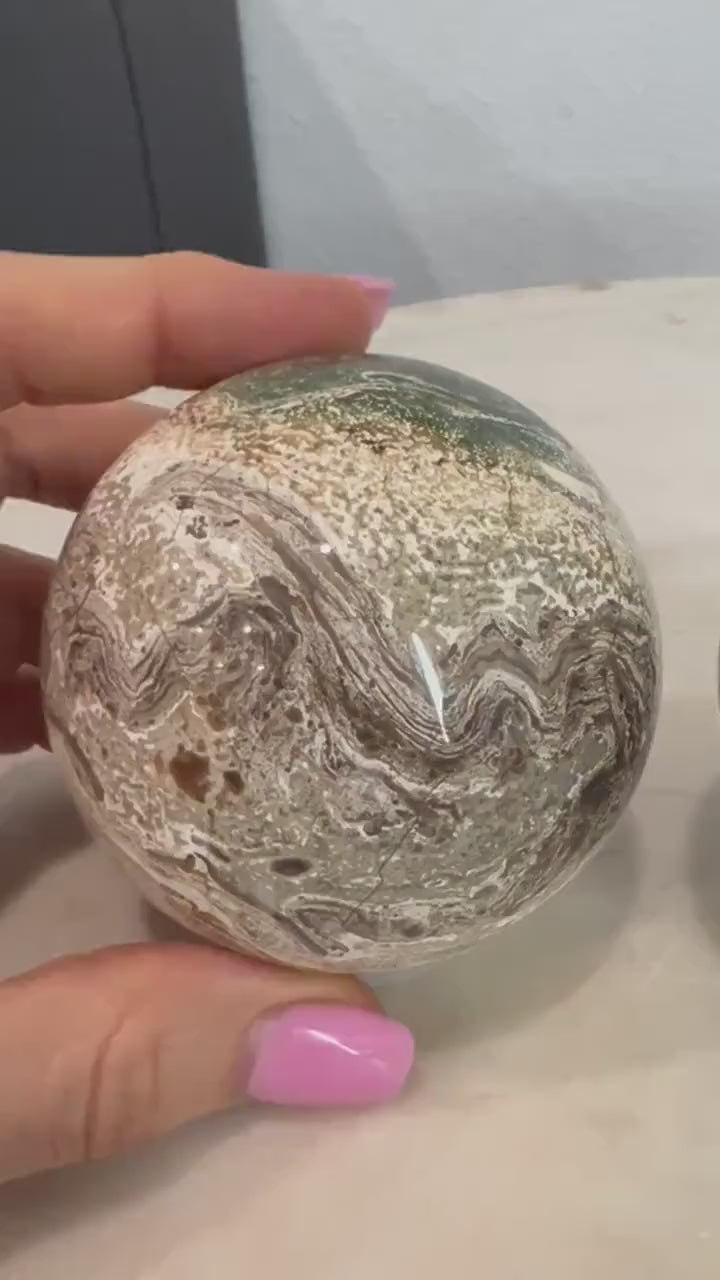 2 Petrified wood spheres from Madagascar. You will get the 2 in the picture total weight 1 pound 13oz .
