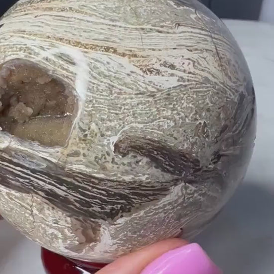 Petrified wood sphere. From Madagascar weight 1 pound 2.3oz 74.9mm druzy inclusion with this item