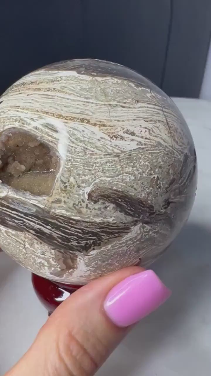 Petrified wood sphere. From Madagascar weight 1 pound 2.3oz 74.9mm druzy inclusion with this item