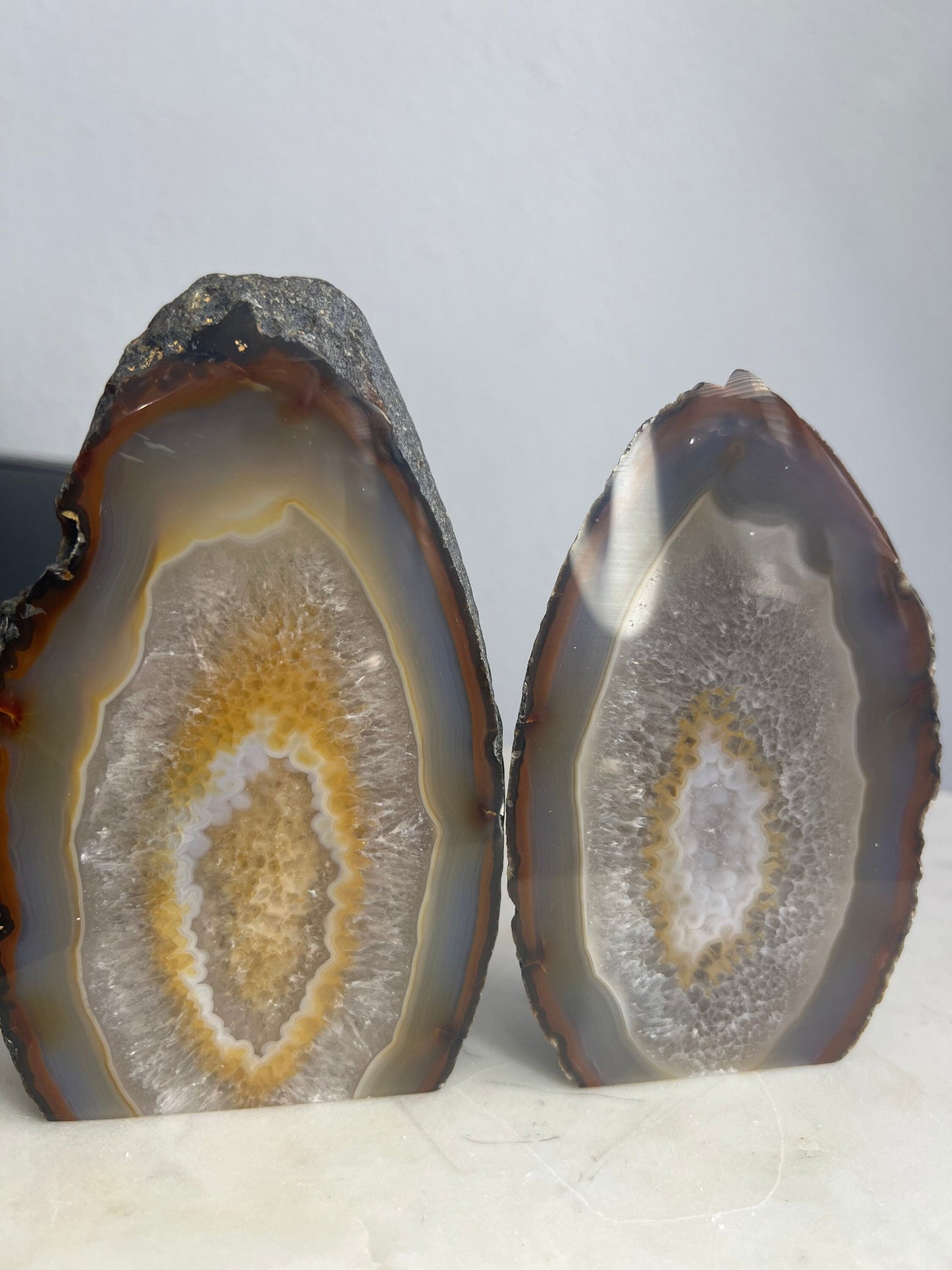 Geode 2 matching pieces 1 is larger than the other. But they have same colors. From Brazil. 3pounds 3oz total weight. Rough back polished fr