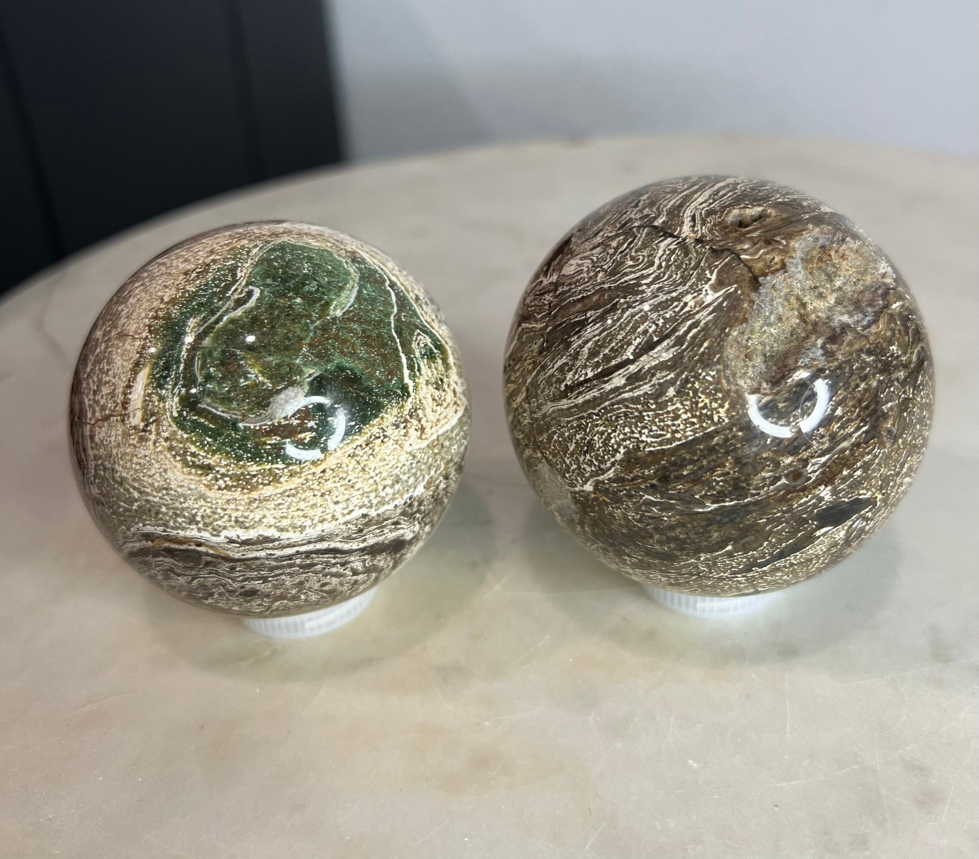 2 Petrified wood spheres from Madagascar. You will get the 2 in the picture total weight 1 pound 13oz .