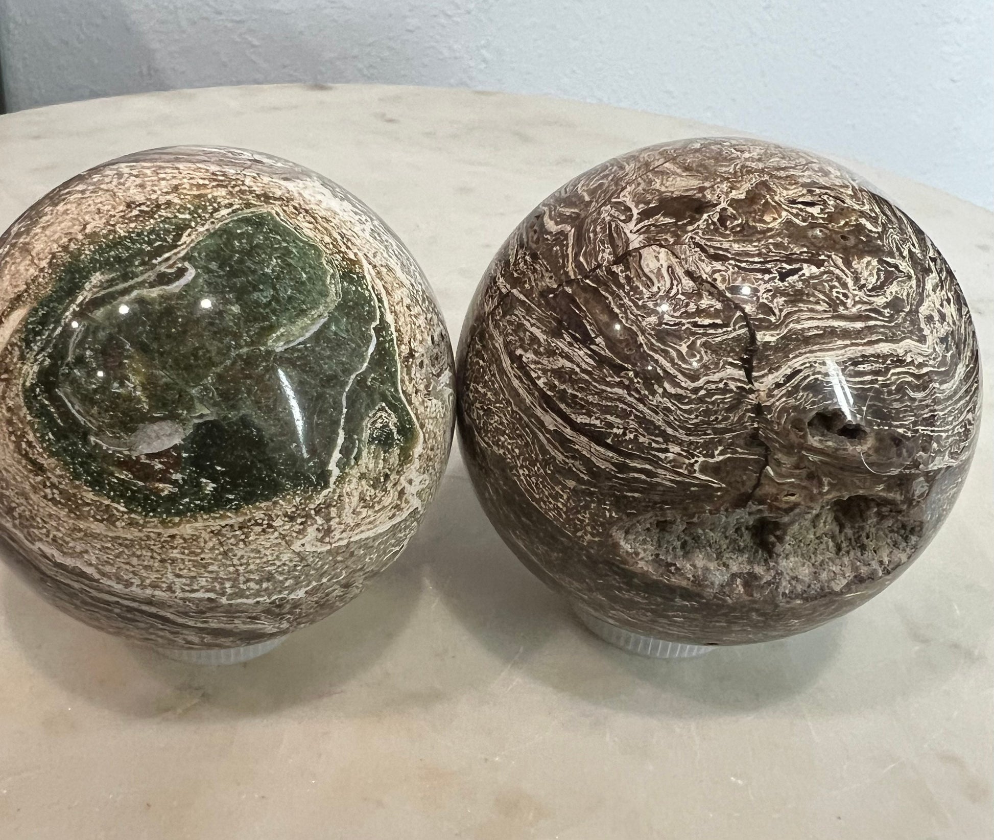 2 Petrified wood spheres from Madagascar. You will get the 2 in the picture total weight 1 pound 13oz .