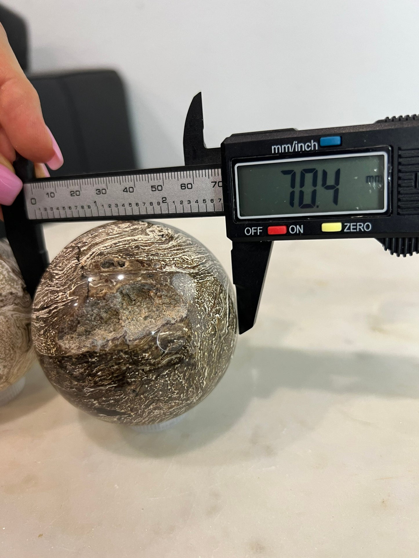 2 Petrified wood spheres from Madagascar. You will get the 2 in the picture total weight 1 pound 13oz .