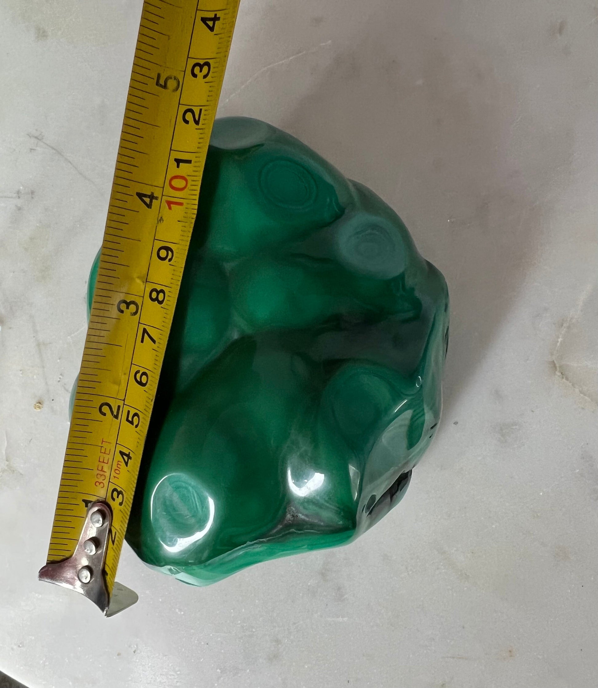 malachite polished from Congo almost 5 inches long and over 2 pounds.