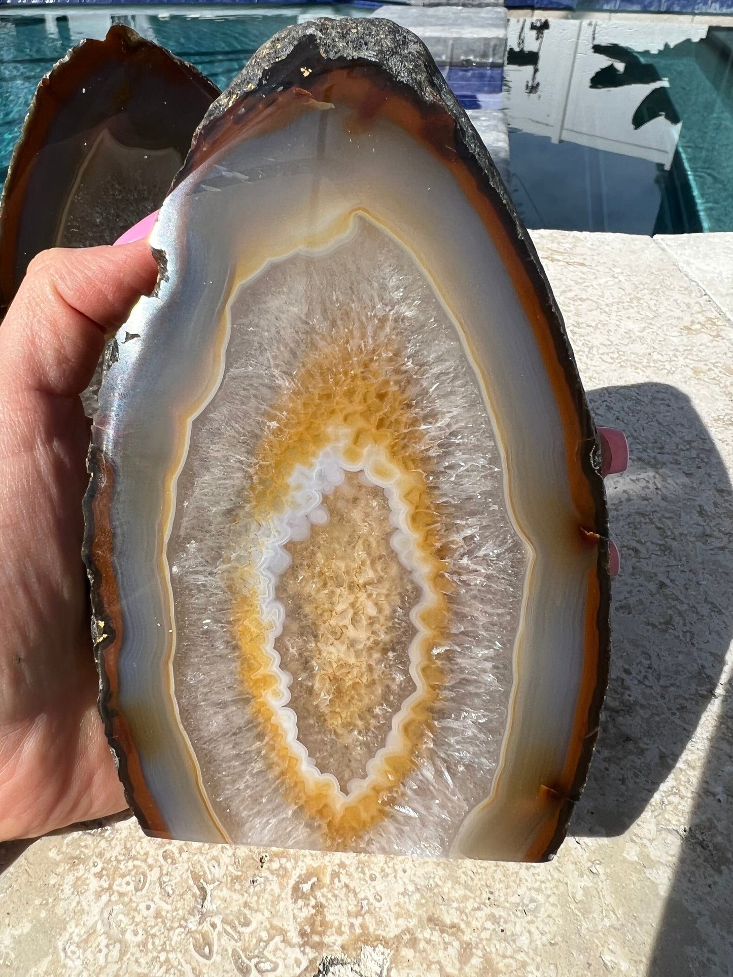 Geode 2 matching pieces 1 is larger than the other. But they have same colors. From Brazil. 3pounds 3oz total weight. Rough back polished fr
