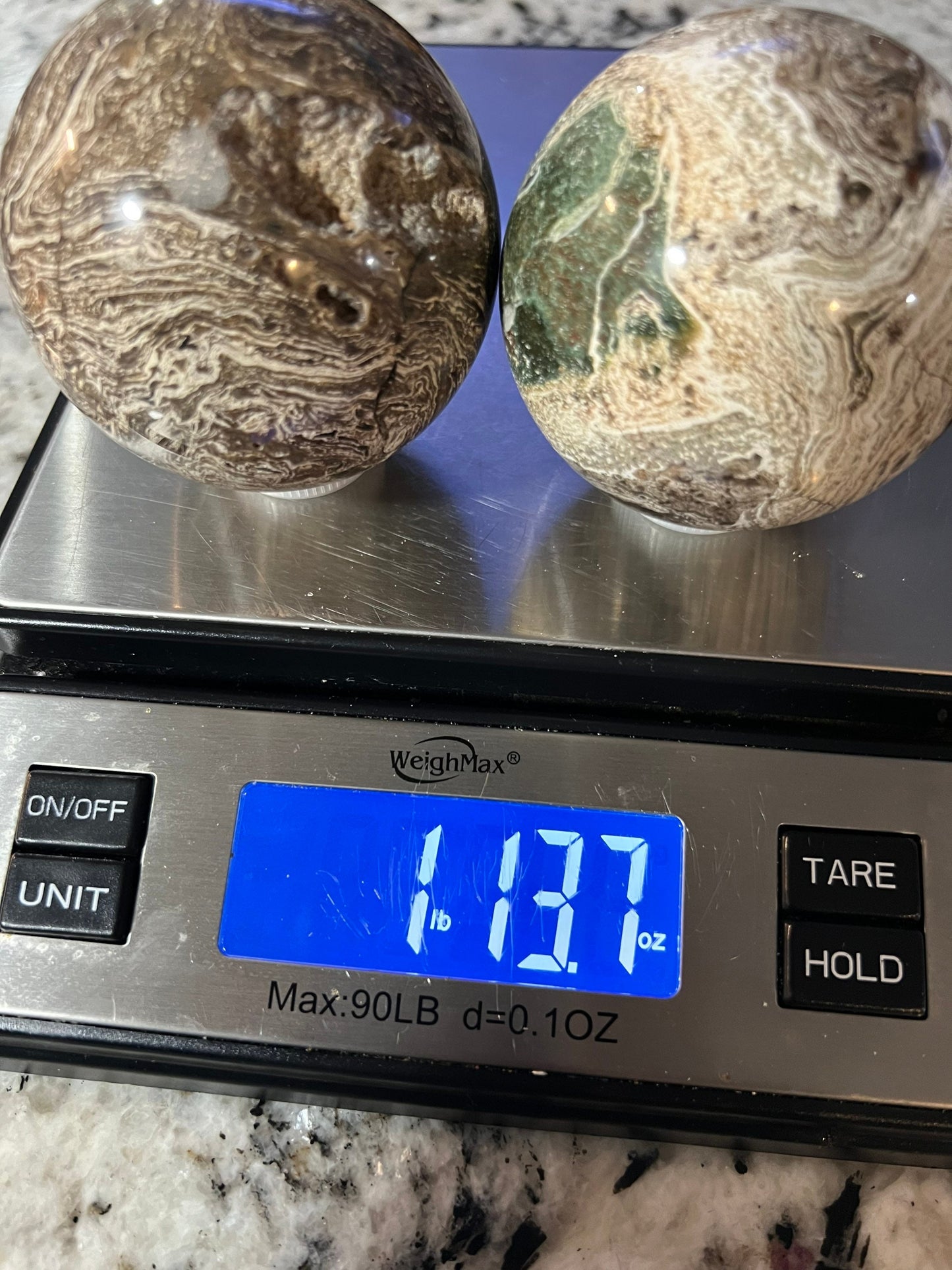 2 Petrified wood spheres from Madagascar. You will get the 2 in the picture total weight 1 pound 13oz .