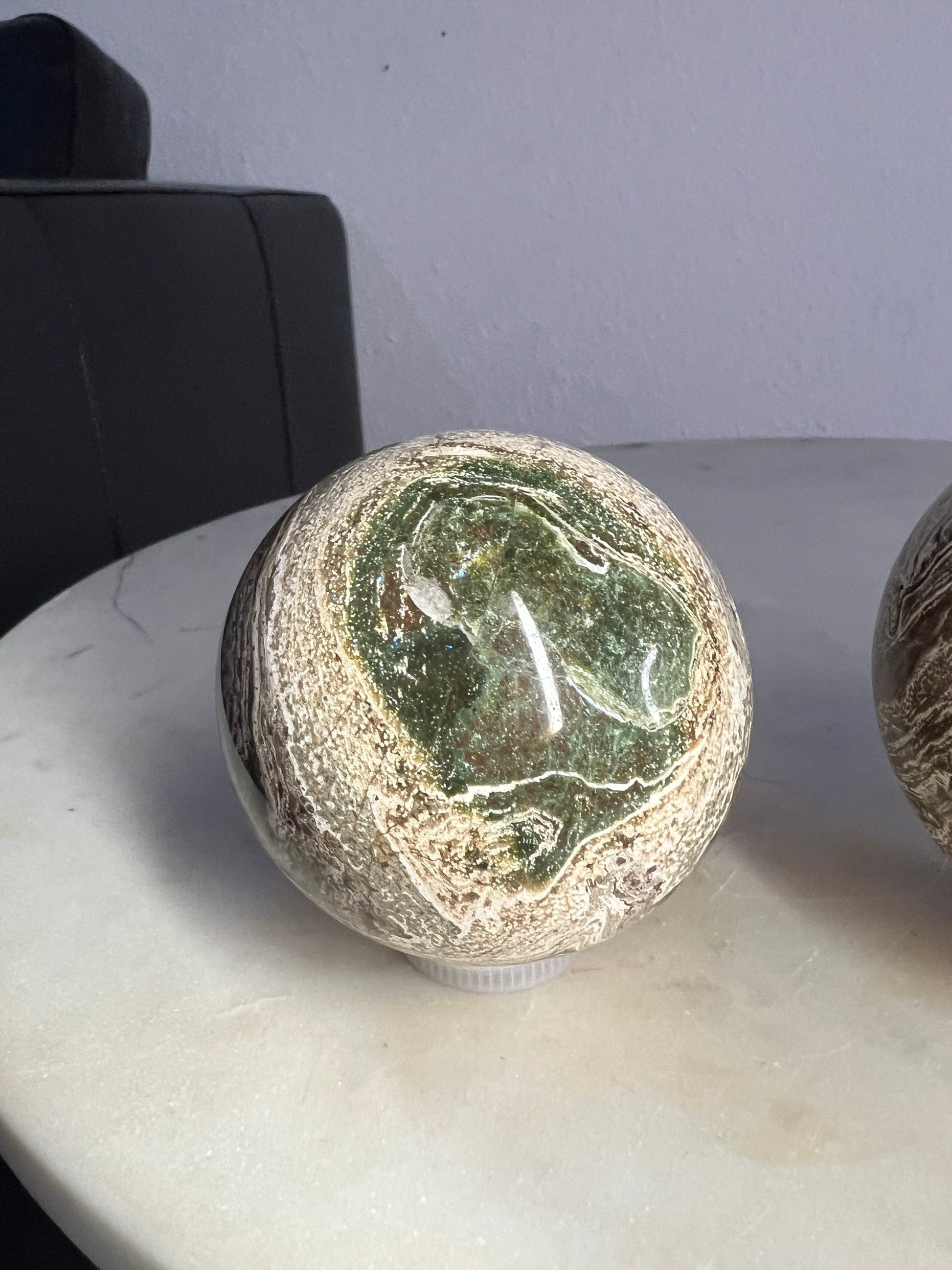 2 Petrified wood spheres from Madagascar. You will get the 2 in the picture total weight 1 pound 13oz .