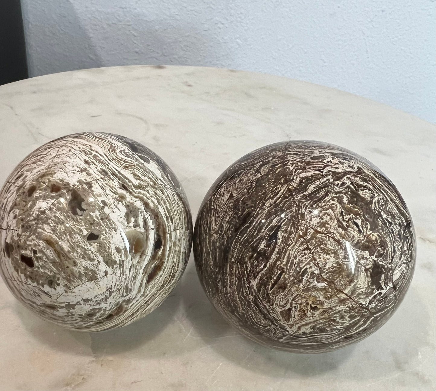 2 Petrified wood spheres from Madagascar. You will get the 2 in the picture total weight 1 pound 13oz .