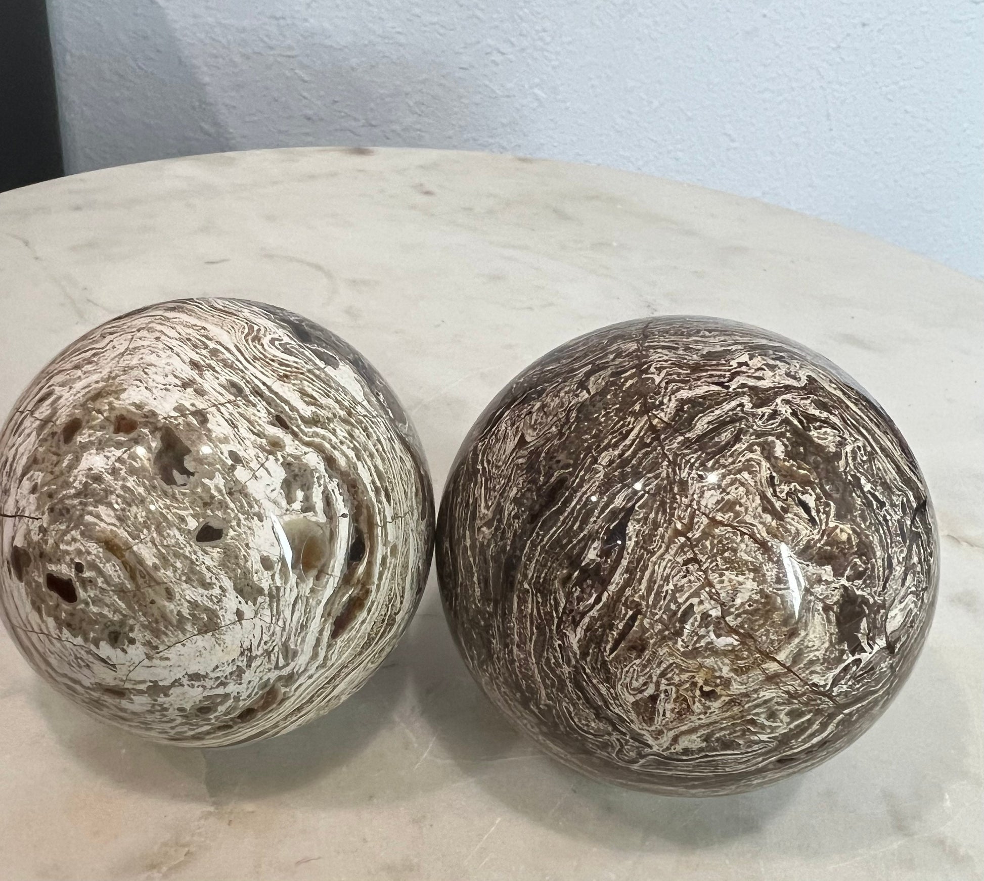 2 Petrified wood spheres from Madagascar. You will get the 2 in the picture total weight 1 pound 13oz .