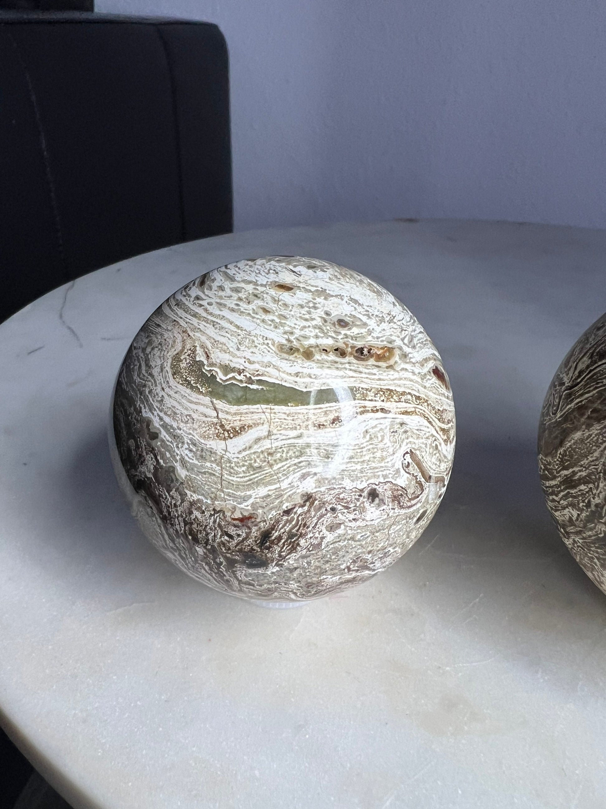 2 Petrified wood spheres from Madagascar. You will get the 2 in the picture total weight 1 pound 13oz .