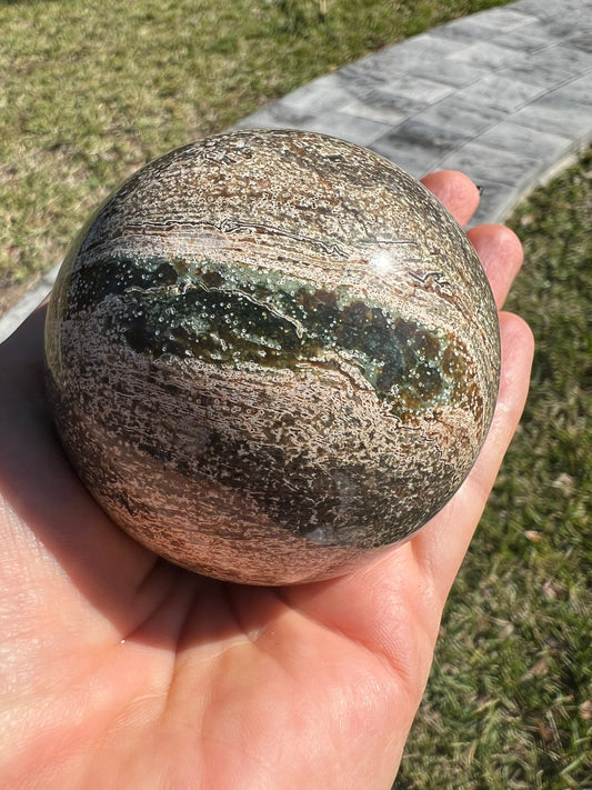 Petrified wood sphere from Madagascar. 12oz and 64mm