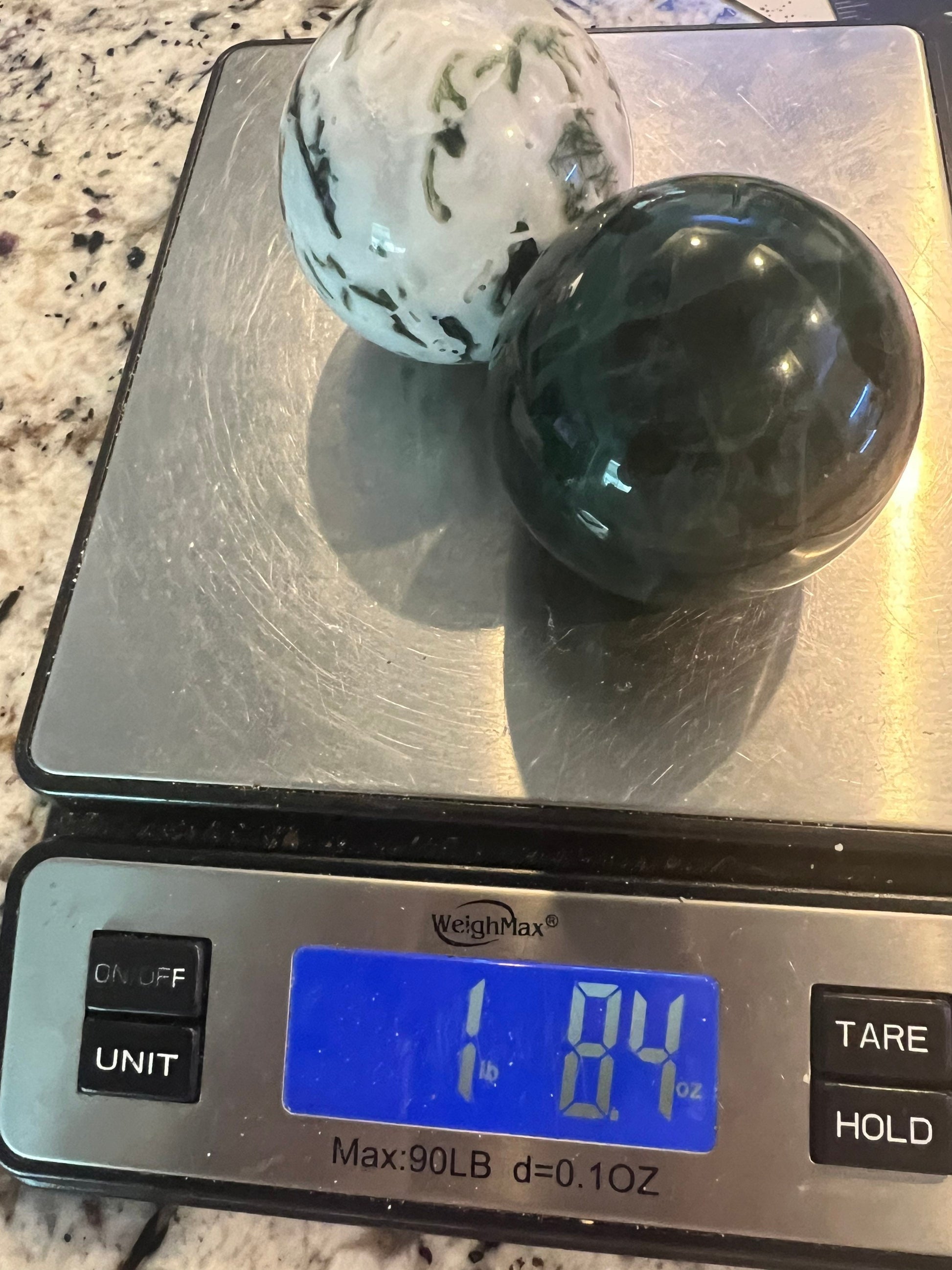 2 sphere set total weight 1pound 8oz. 1 moss agate and 1 dark green fluorite.